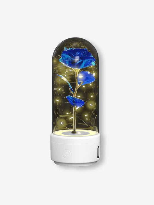 Lampe de chevet romantique avec bluetooth en forme de rose sous cloche sur son socle blanc